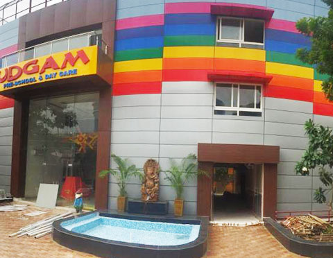 Educational project — a bright child-centric play school classroom with bold colour blocking